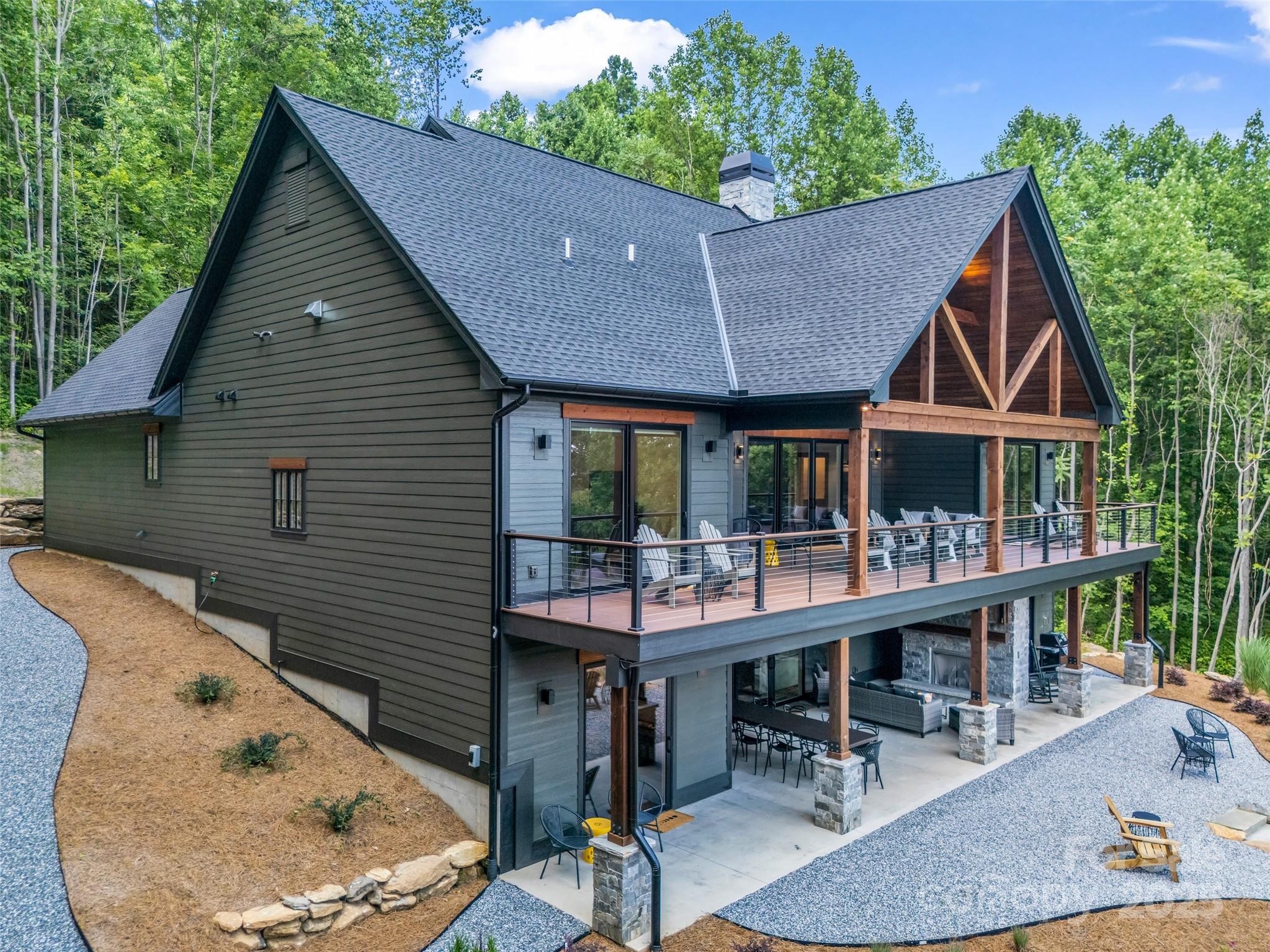 627 Cherry Hill, Unit 201 Mill Spring, NC 28756 - Photo 37 of 48 a aerial view of a house with a porch