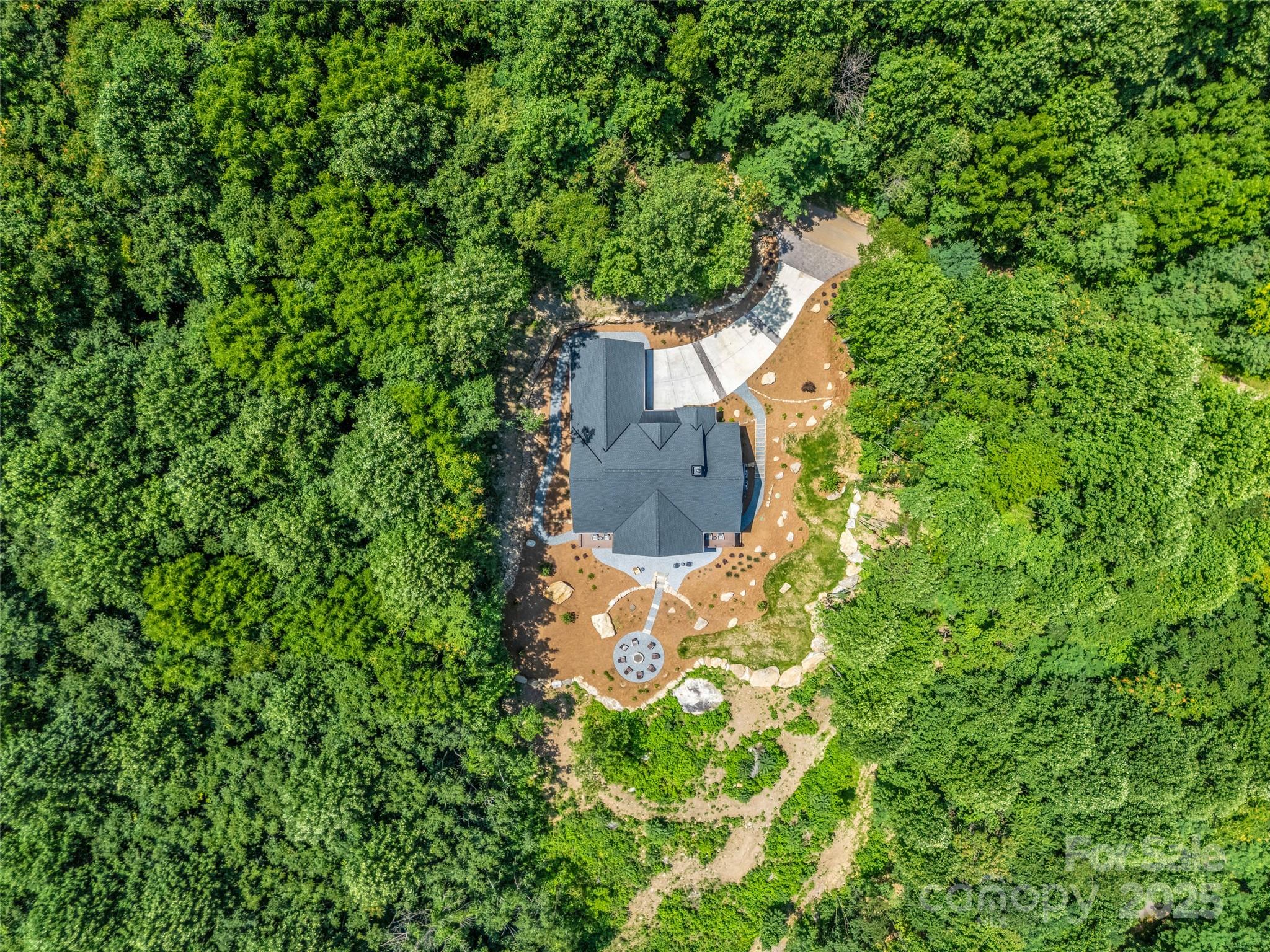 627 Cherry Hill, Unit 201 Mill Spring, NC 28756 - Photo 39 of 48 an aerial view of a house with a yard