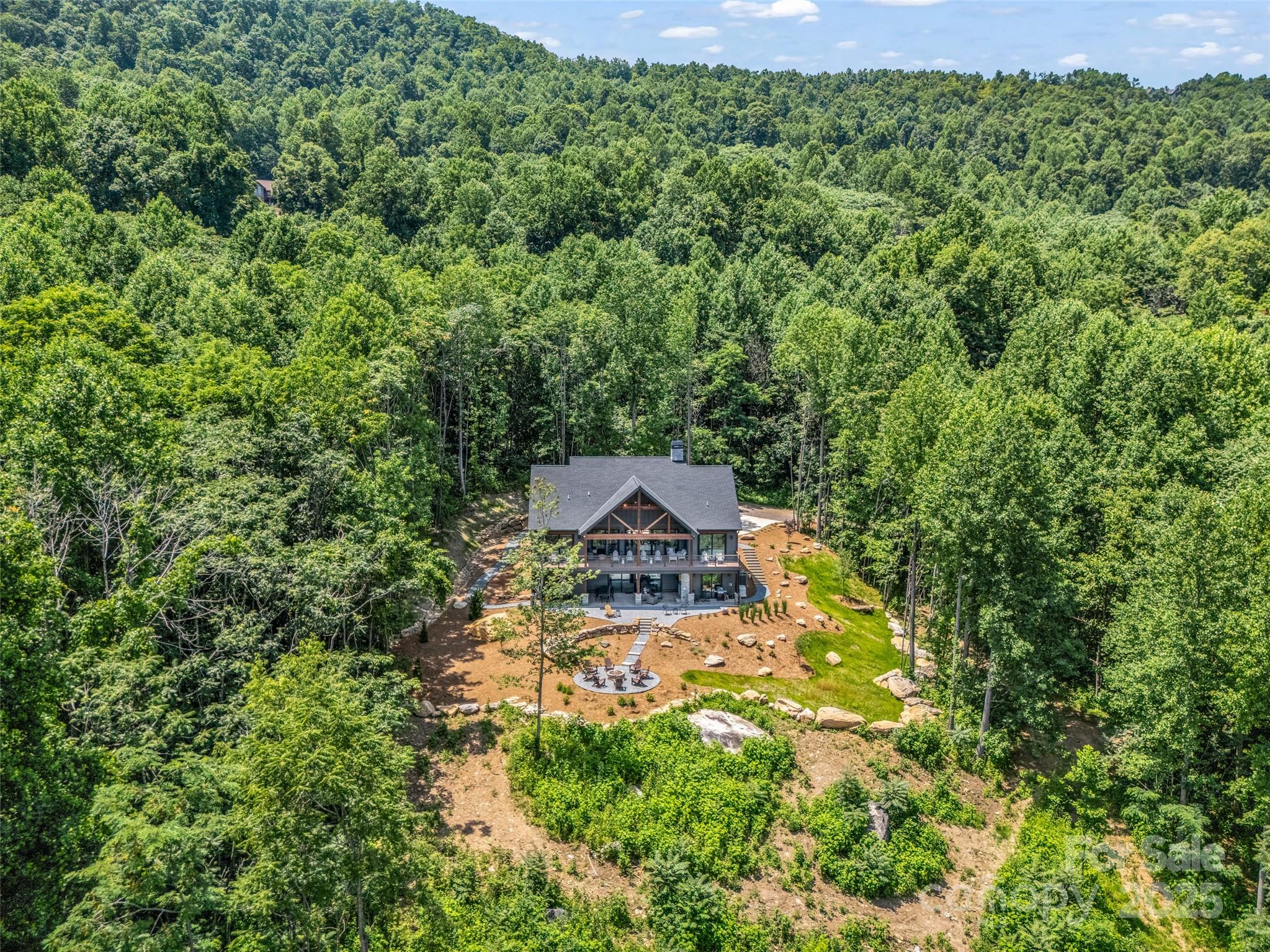 627 Cherry Hill, Unit 201 Mill Spring, NC 28756 - Photo 40 of 48 a view of a house with a yard