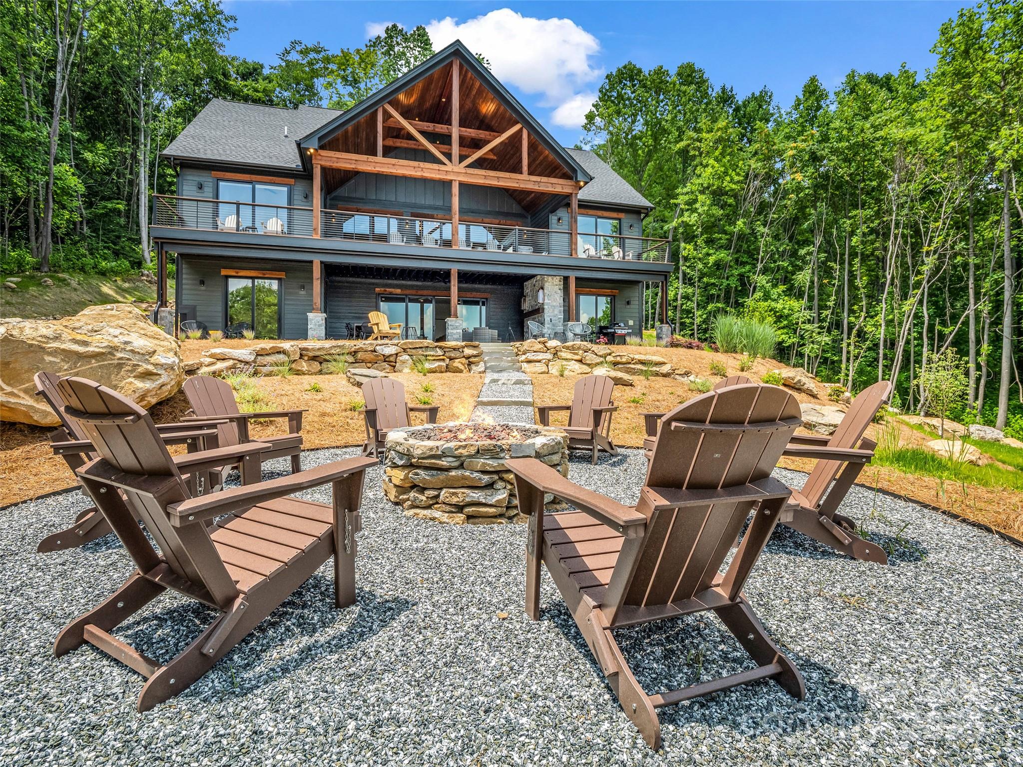 627 Cherry Hill, Unit 201 Mill Spring, NC 28756 - Photo 41 of 48 a view of a dinning table and chairs in the patio