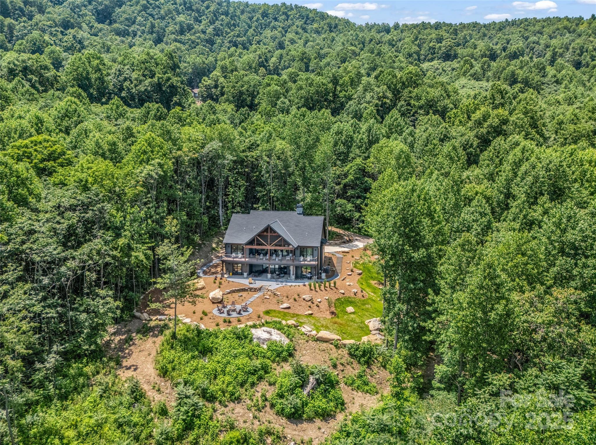 627 Cherry Hill, Unit 201 Mill Spring, NC 28756 - Photo 43 of 48 an aerial view of a house with yard swimming pool and outdoor seating