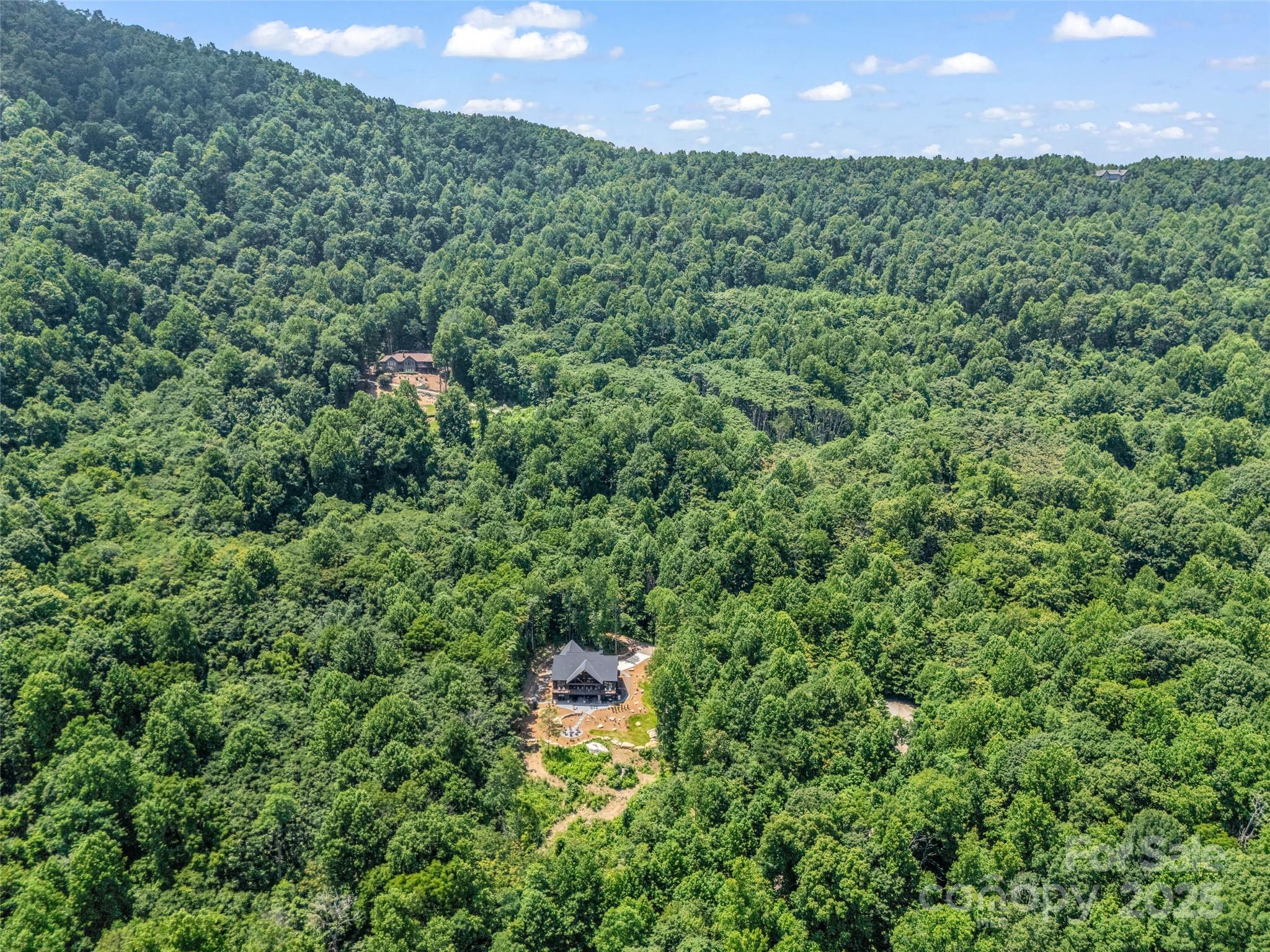 627 Cherry Hill, Unit 201 Mill Spring, NC 28756 - Photo 44 of 48 a view of a big yard with lots of green space