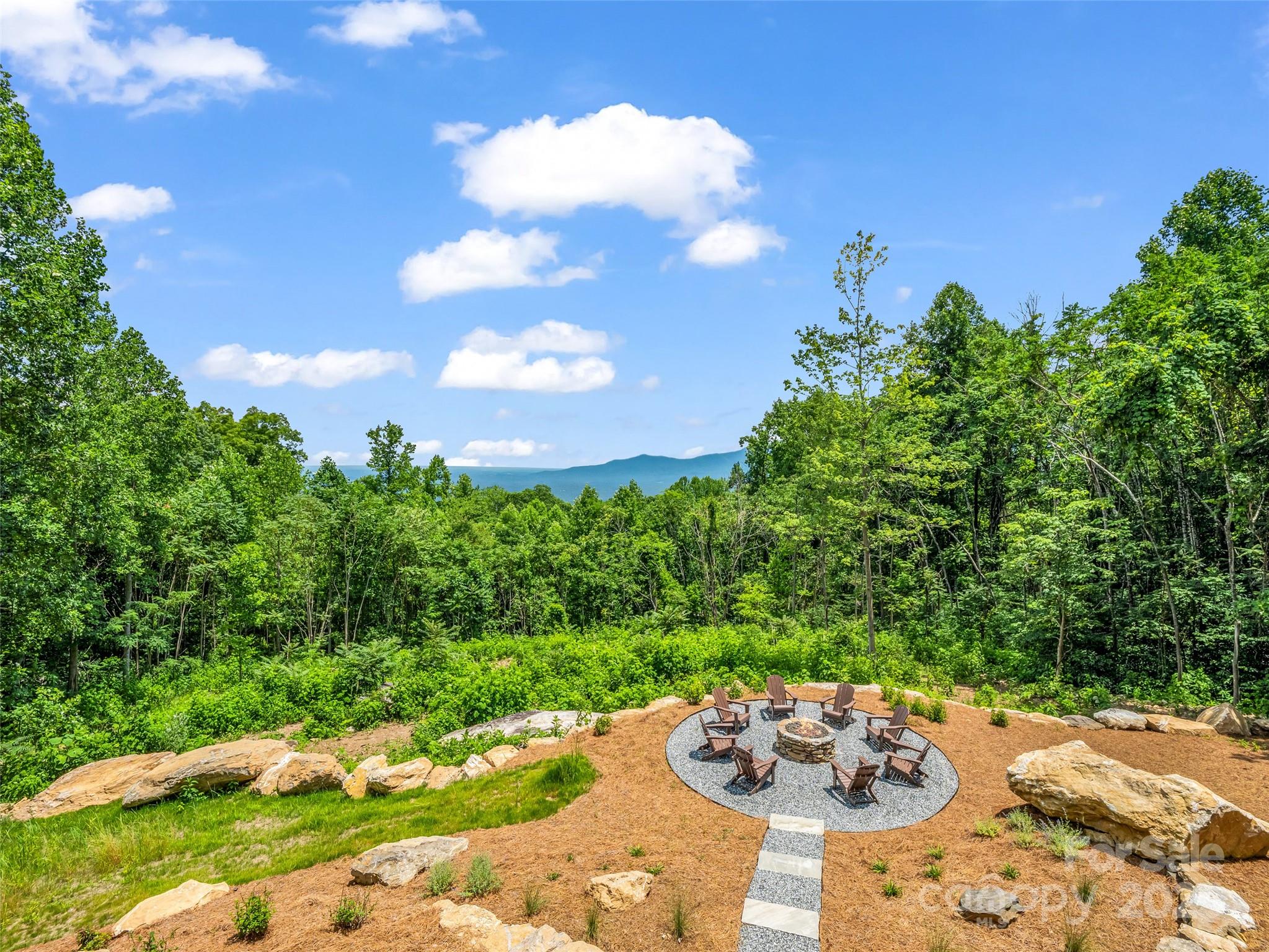 627 Cherry Hill, Unit 201 Mill Spring, NC 28756 - Photo 47 of 48 a view of a garden with a flower garden