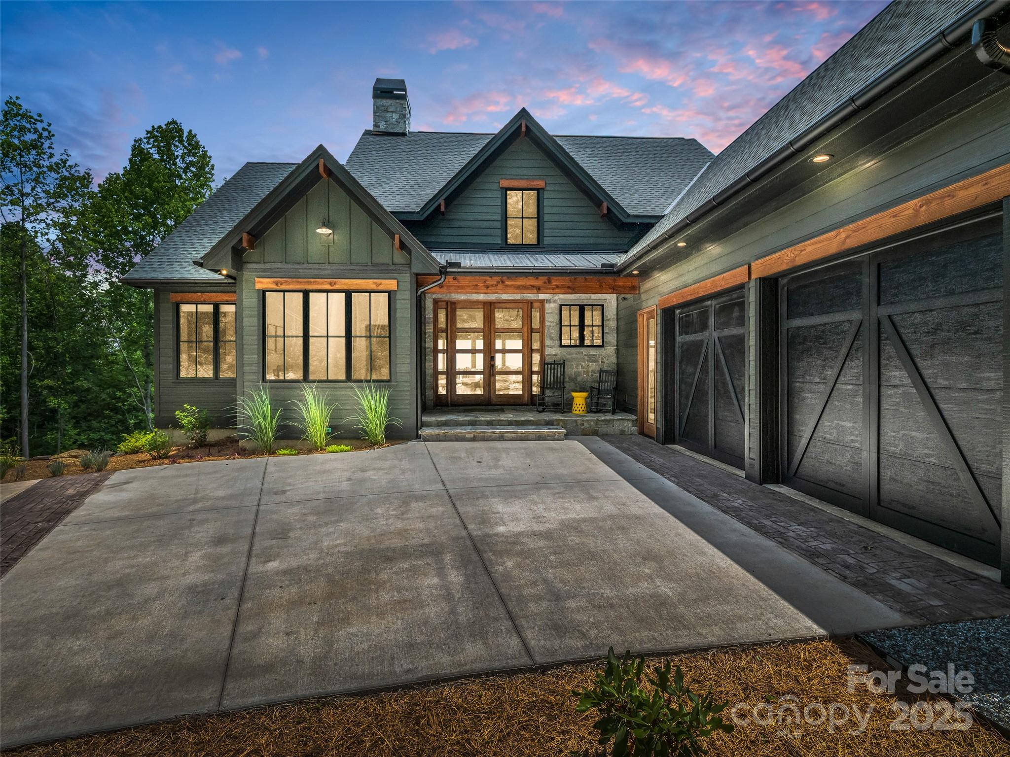 627 Cherry Hill, Unit 201 Mill Spring, NC 28756 - Photo 48 of 48 a front view of a house with garden