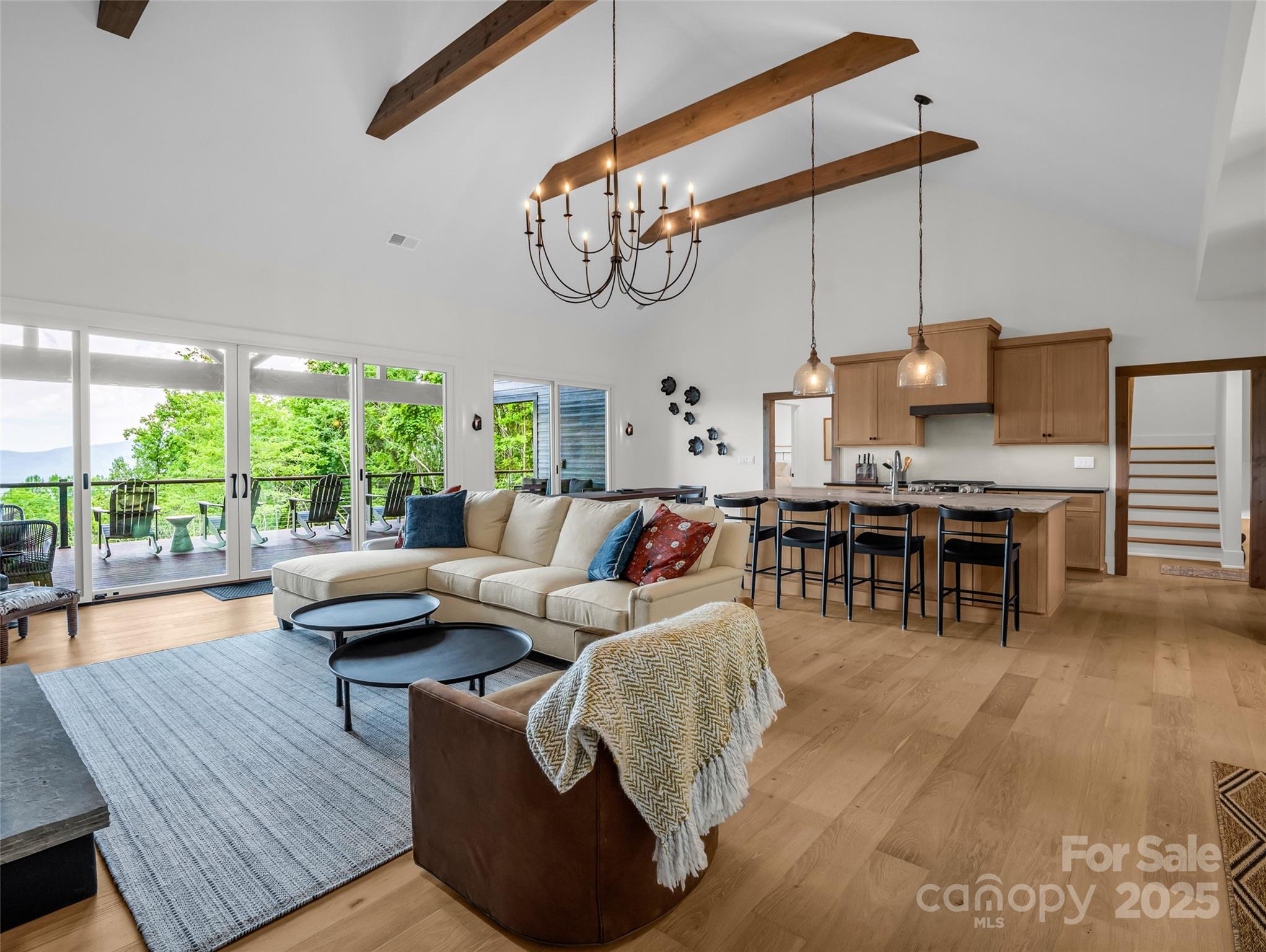 627 Cherry Hill, Unit 201 Mill Spring, NC 28756 - Photo 7 of 48 a living room with furniture and a large window