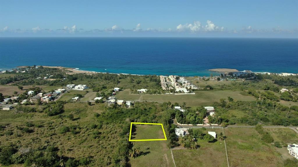Carr Pozo Dulce Bo Jobos Isabela, PR 00662 - Photo 1 of 1 an aerial view of a houses with a lake view