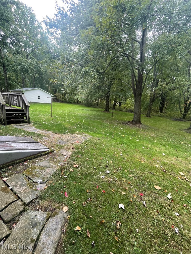 7815 Cemetery Road Vermilion, OH 44089 - Photo 42 of 43 View of yard with a deck