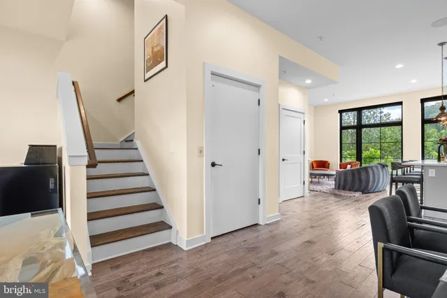 a view of a livingroom with furniture and staircase