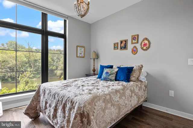 a bed sitting in a bedroom next to a window