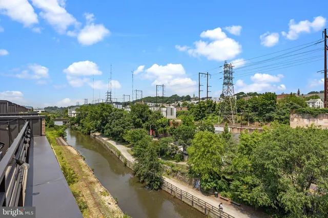a view of a street with a building in the background