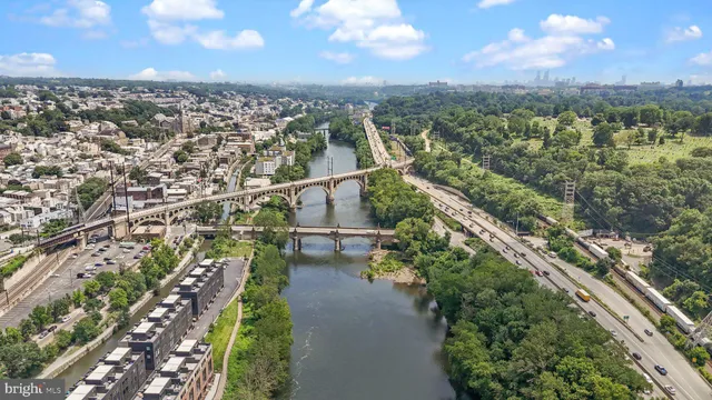 an aerial view of multiple houses with yard