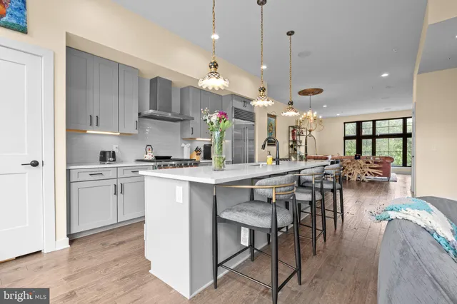 a kitchen with counter space dining table and chairs