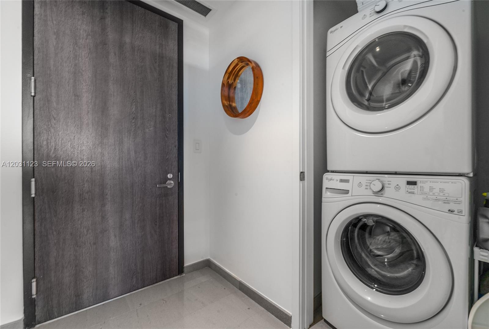 88 Southwest 7th Street, Unit 3208 Miami, FL 33130 - Photo 12 of 16 a view of storage and utility room with washer and dryer