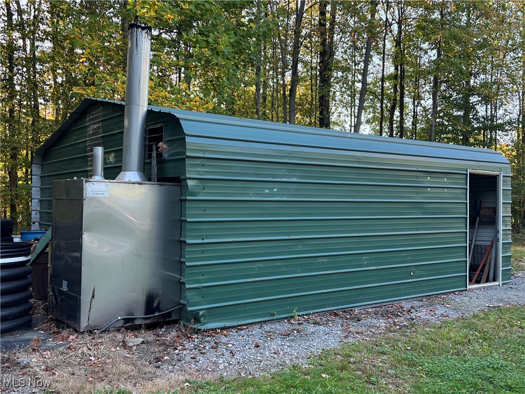 7262 Turner Road Pierpont, OH 44082 - Photo 40 of 45 Woodshed with outdoor wood stove for house
