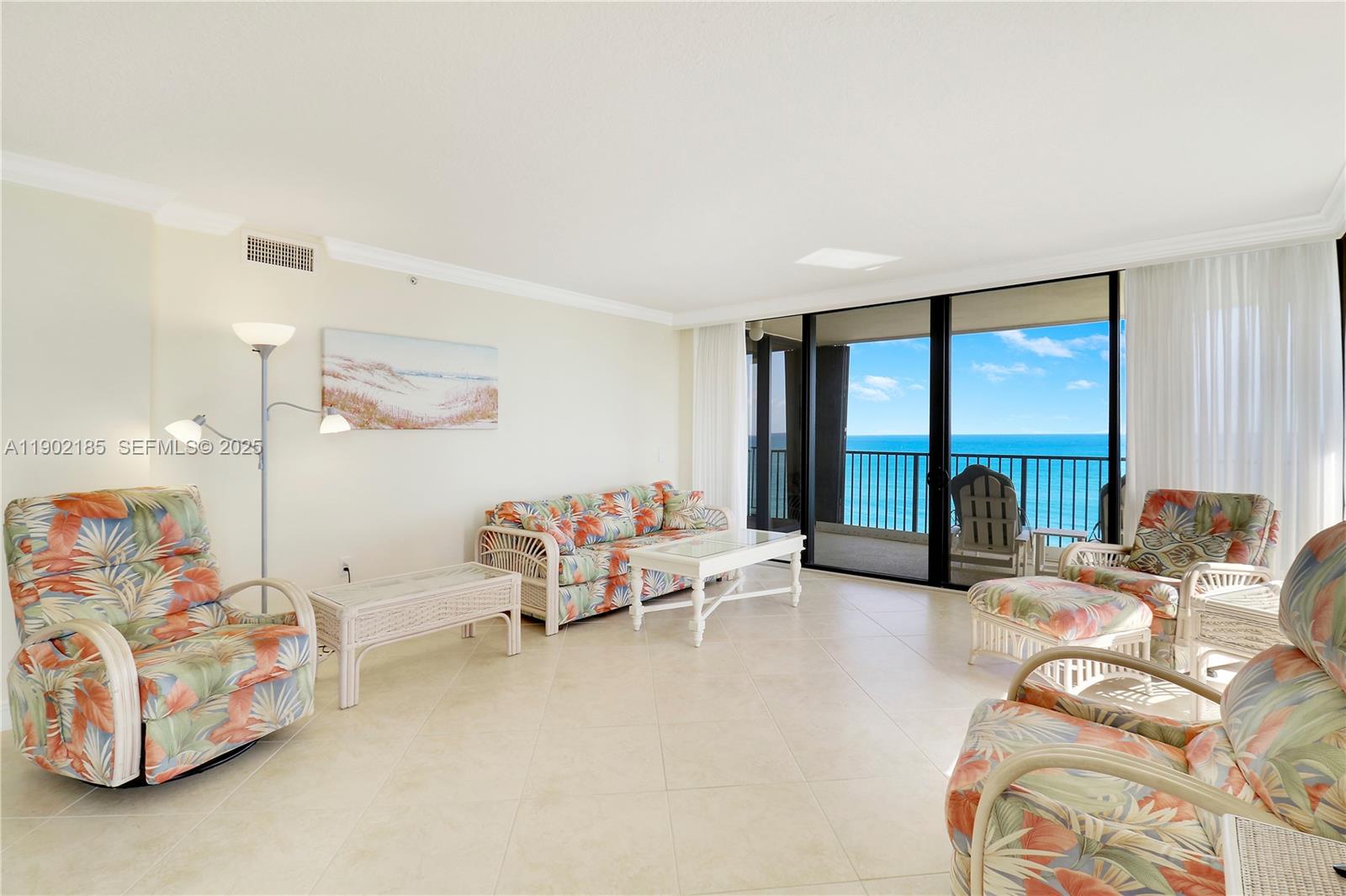 200 South Beach Road, Unit 703 Tequesta, FL 33469 - Photo 12 of 52 a living room with furniture and a large window