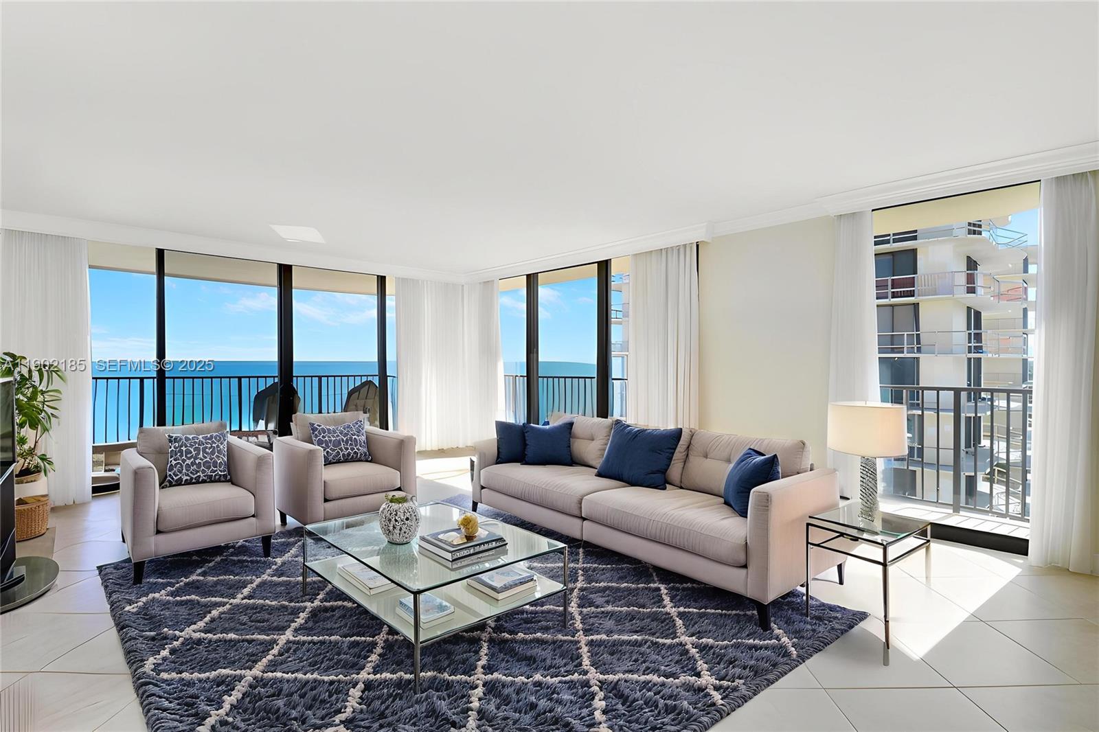 200 South Beach Road, Unit 703 Tequesta, FL 33469 - Photo 15 of 52 a living room with furniture and a large window
