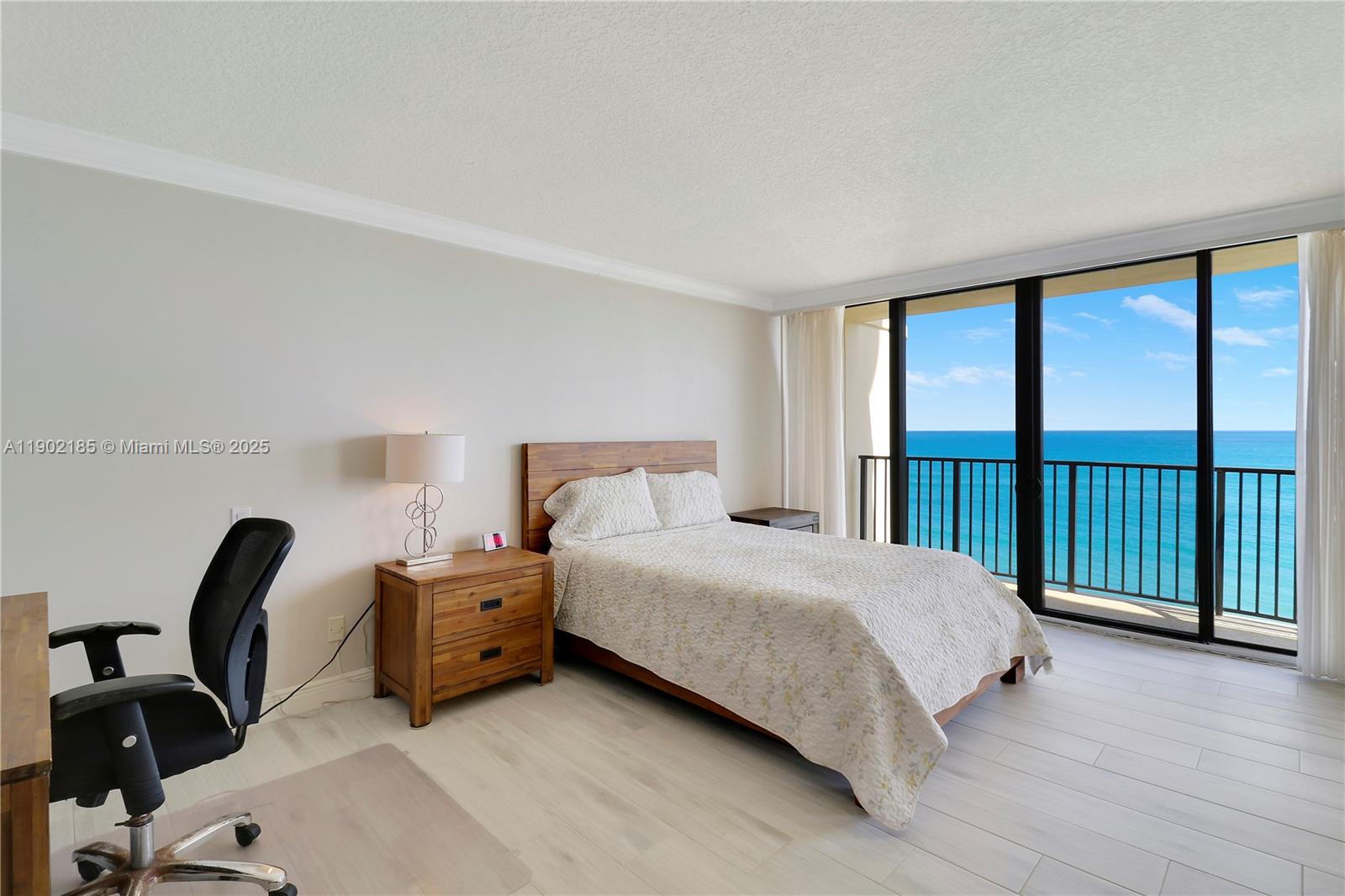 200 South Beach Road, Unit 703 Tequesta, FL 33469 - Photo 16 of 52 a bedroom with a bed and a large window