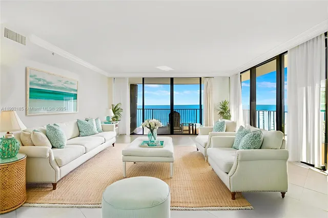 a bedroom with a bed and a flat screen tv in white walls