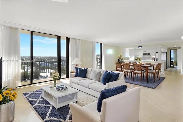a large white kitchen with a large window