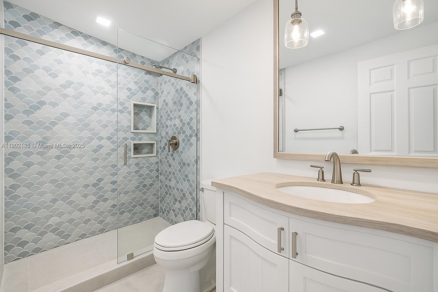 200 South Beach Road, Unit 703 Tequesta, FL 33469 - Photo 38 of 52 a bathroom with a sink a toilet and shower