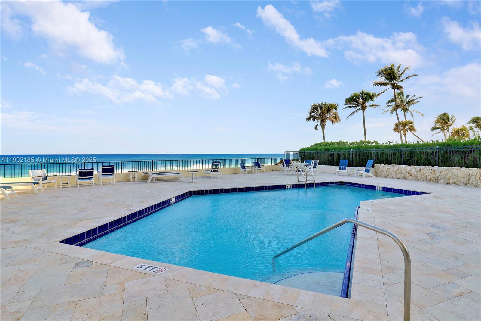 200 South Beach Road, Unit 703 Tequesta, FL 33469 - Photo 44 of 52 a view of a swimming pool and an outdoor seating