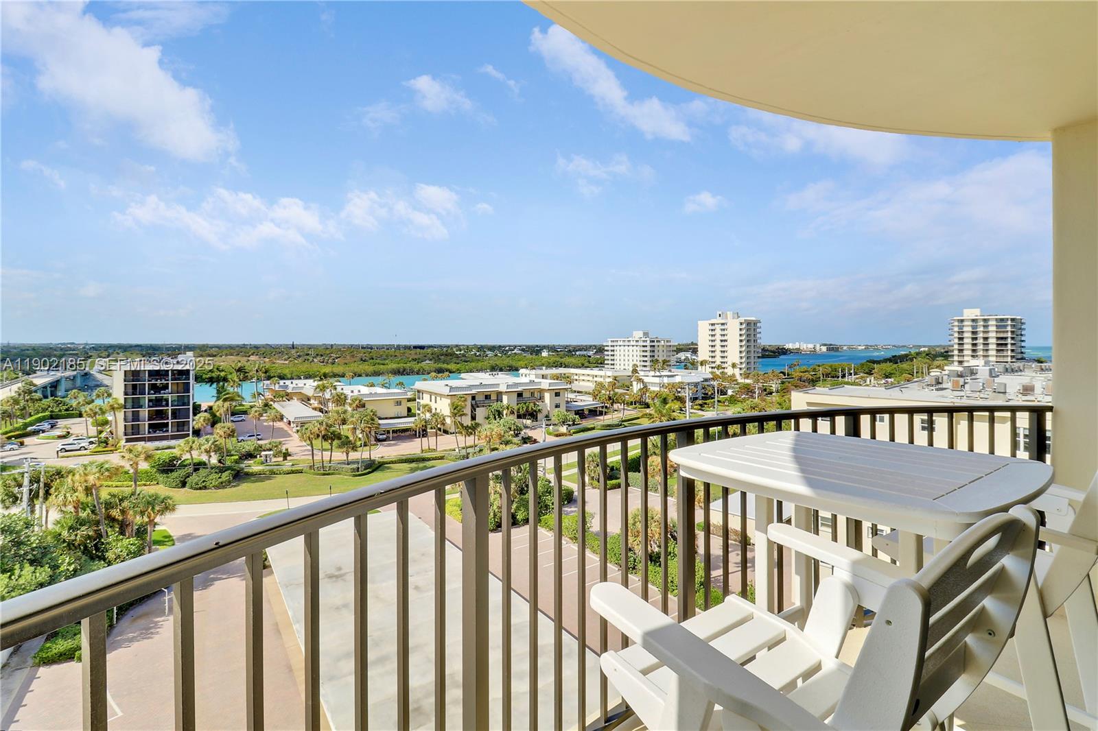 200 South Beach Road, Unit 703 Tequesta, FL 33469 - Photo 6 of 52 a view of a city from a balcony with outdoor seating