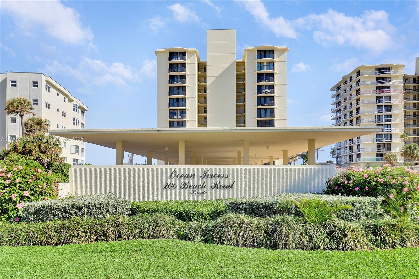 200 South Beach Road, Unit 703 Tequesta, FL 33469 - Photo 7 of 52 front view of building with an outdoor space