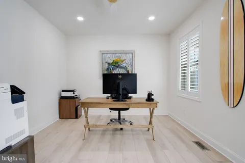 a kitchen with stainless steel appliances granite countertop a stove a sink and a wooden floors