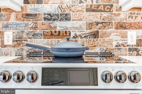 a bedroom with a bed table and a window