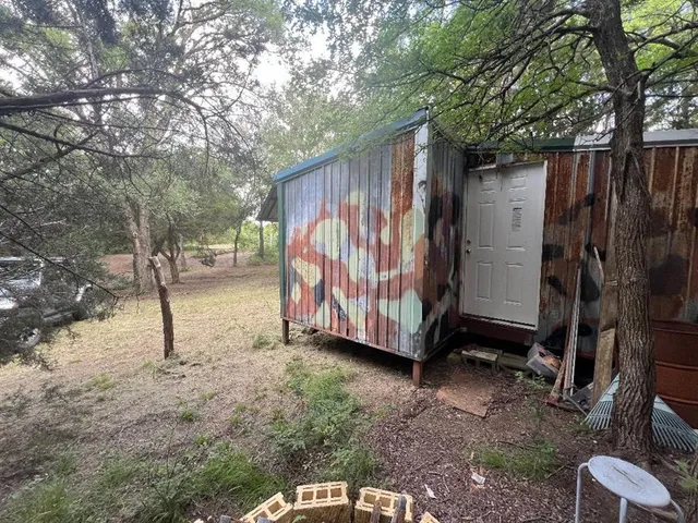a view of a backyard with furniture
