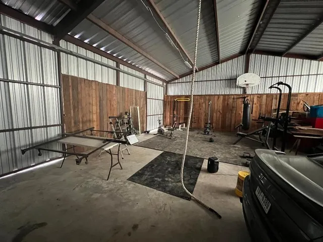 a view of a patio with table and chairs with wooden floor