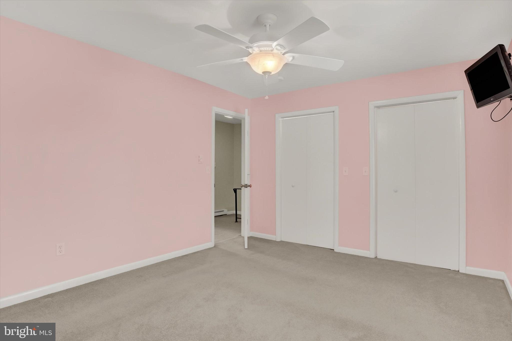 118 South 22nd Street Lebanon, PA 17042 - Photo 15 of 27 an empty room with a flat screen tv and a ceiling fan