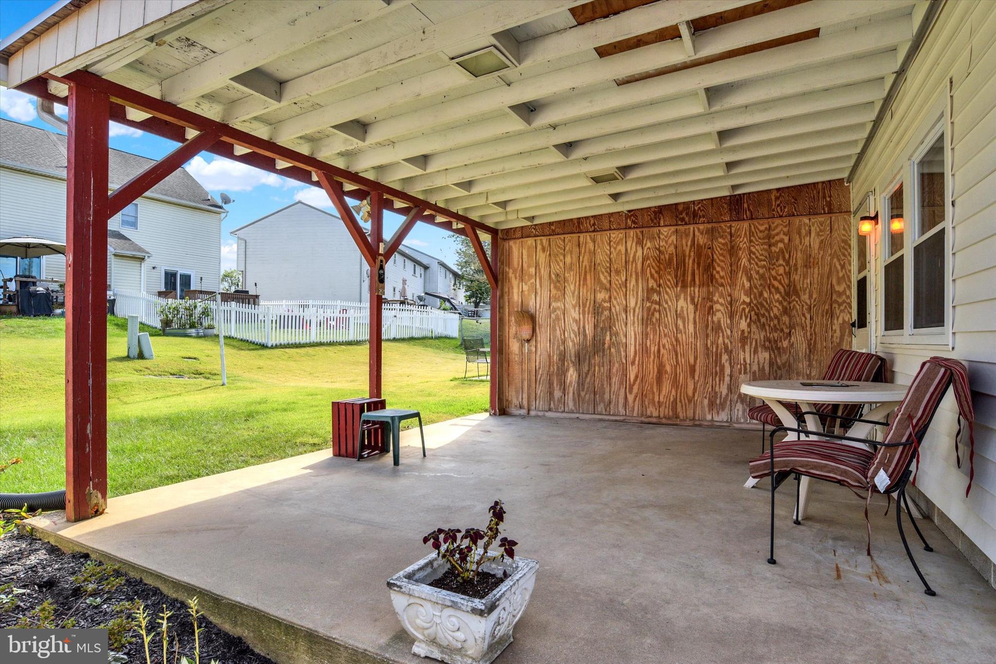 118 South 22nd Street Lebanon, PA 17042 - Photo 23 of 27 a porch with a table and chairs next to a yard