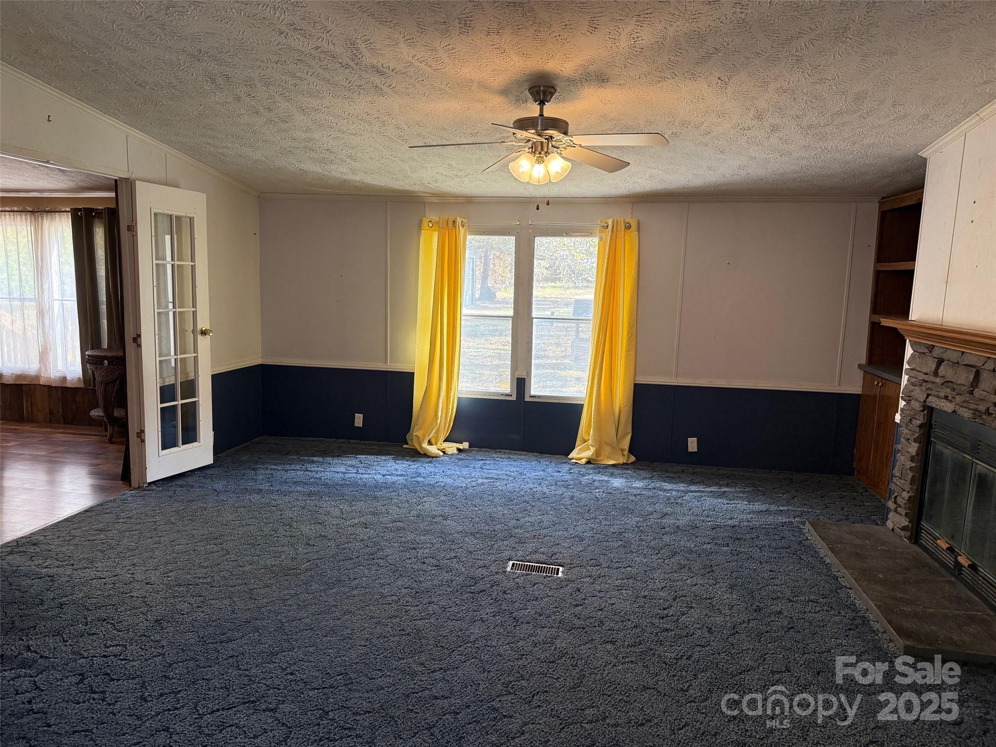 7159 Rev Melvin Adams Road Kershaw, SC 29067 - Photo 22 of 28 a view of livingroom with window and fireplace
