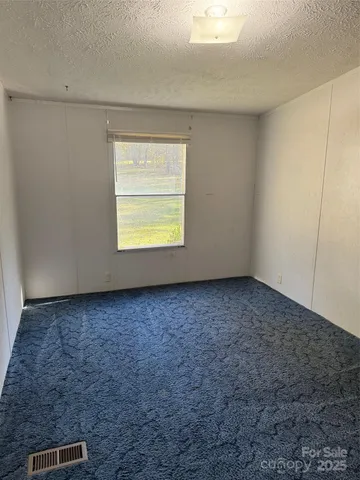 a view of a room that has a window in it