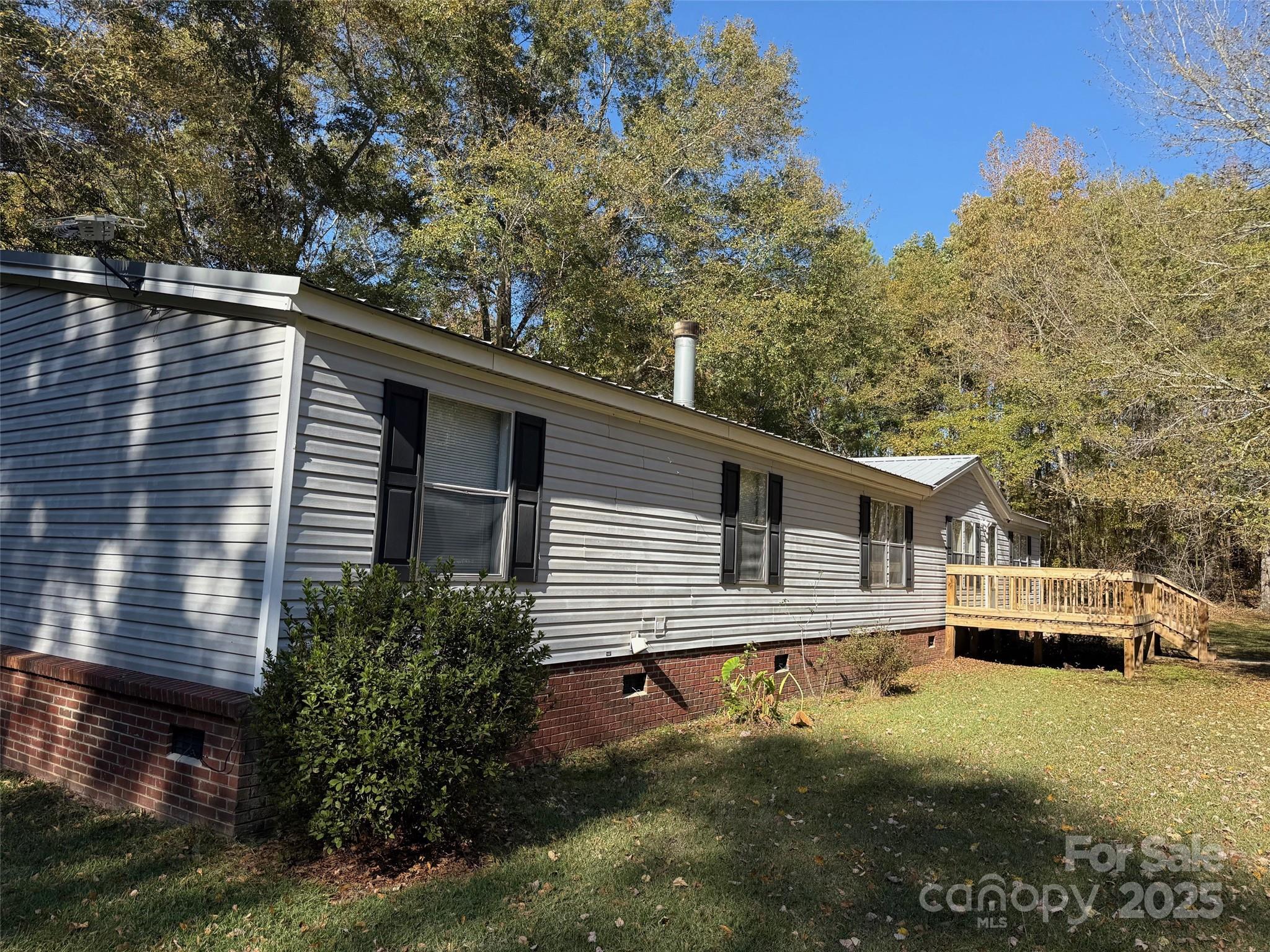 7159 Rev Melvin Adams Road Kershaw, SC 29067 - Photo 25 of 28 a house view with a garden space