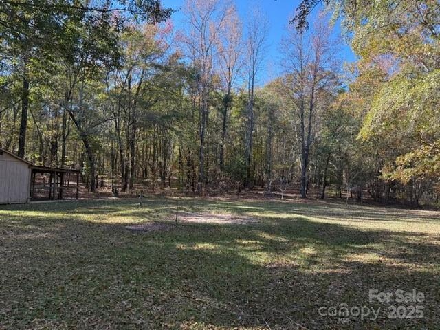 7159 Rev Melvin Adams Road Kershaw, SC 29067 - Photo 5 of 28 a view of a yard with large trees