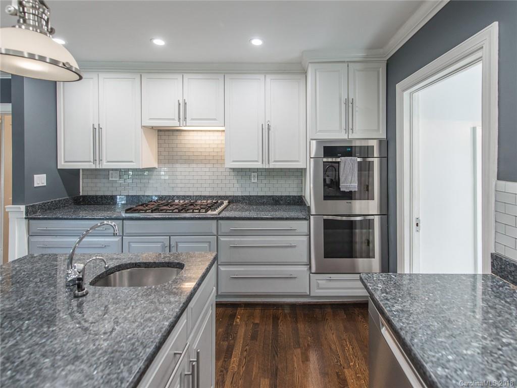2711 Providence Road Charlotte, NC 28211 - Photo 1 of 35 a kitchen with kitchen island granite countertop a sink stove and refrigerator
