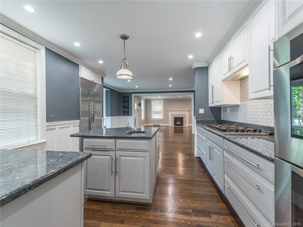 2711 Providence Road Charlotte, NC 28211 - Photo 11 of 35 a large kitchen with stainless steel appliances granite countertop a stove and a sink