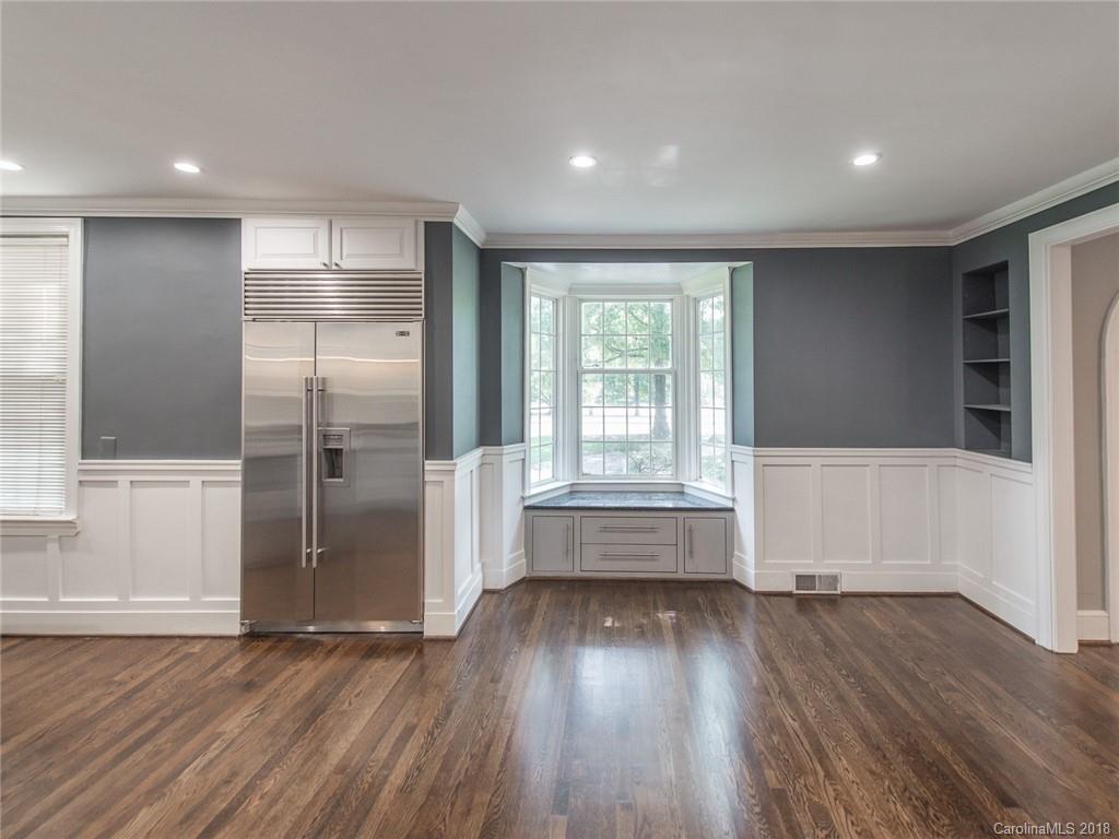2711 Providence Road Charlotte, NC 28211 - Photo 13 of 35 a view of empty room with wooden floor and fan