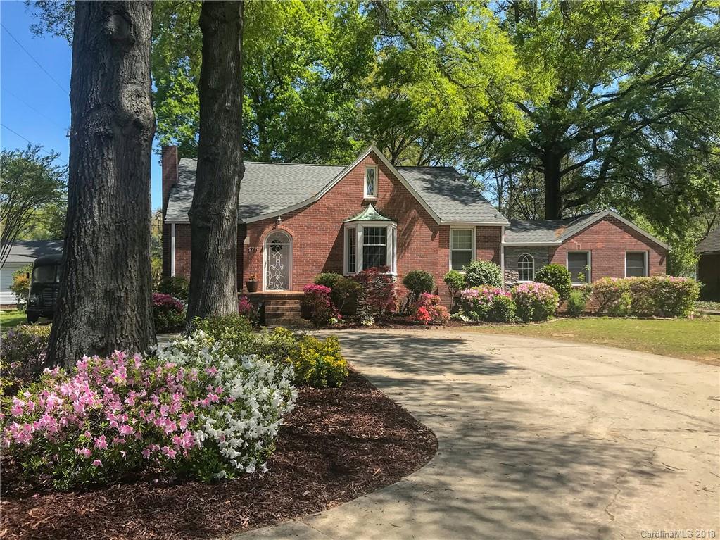 2711 Providence Road Charlotte, NC 28211 - Photo 3 of 35 a front view of a house with a yard and garage