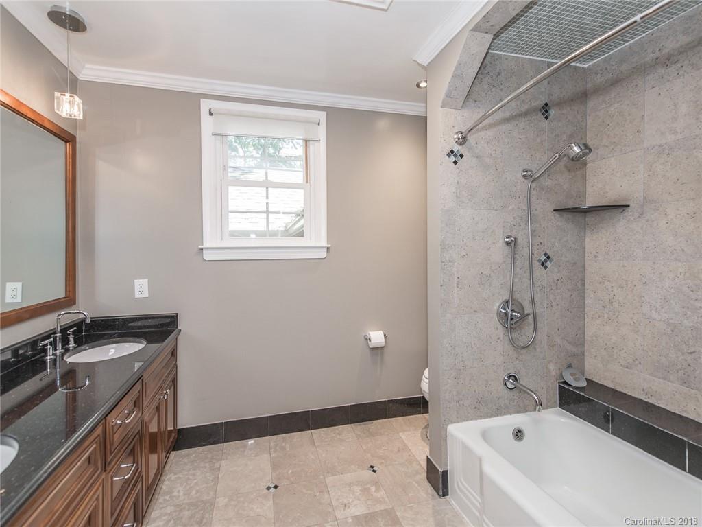 2711 Providence Road Charlotte, NC 28211 - Photo 23 of 35 a bathroom with a bathtub and a shower