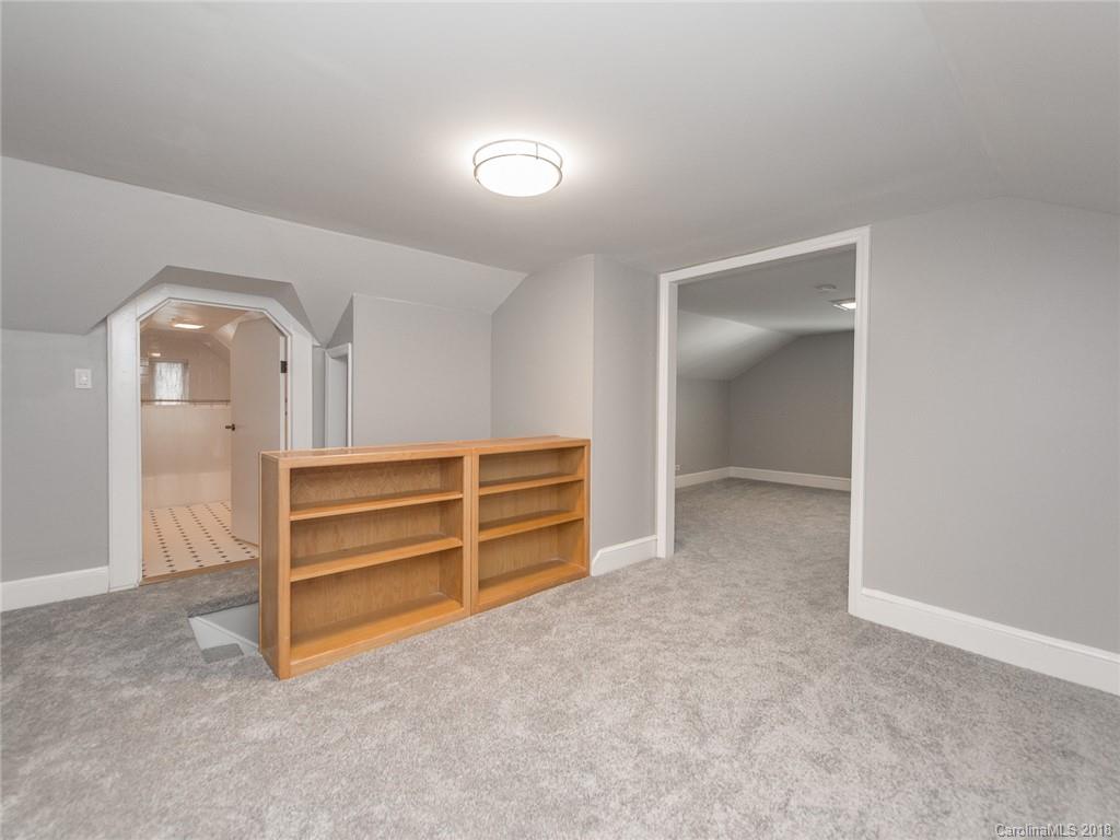 2711 Providence Road Charlotte, NC 28211 - Photo 24 of 35 a view of room with walk in closet and bedroom