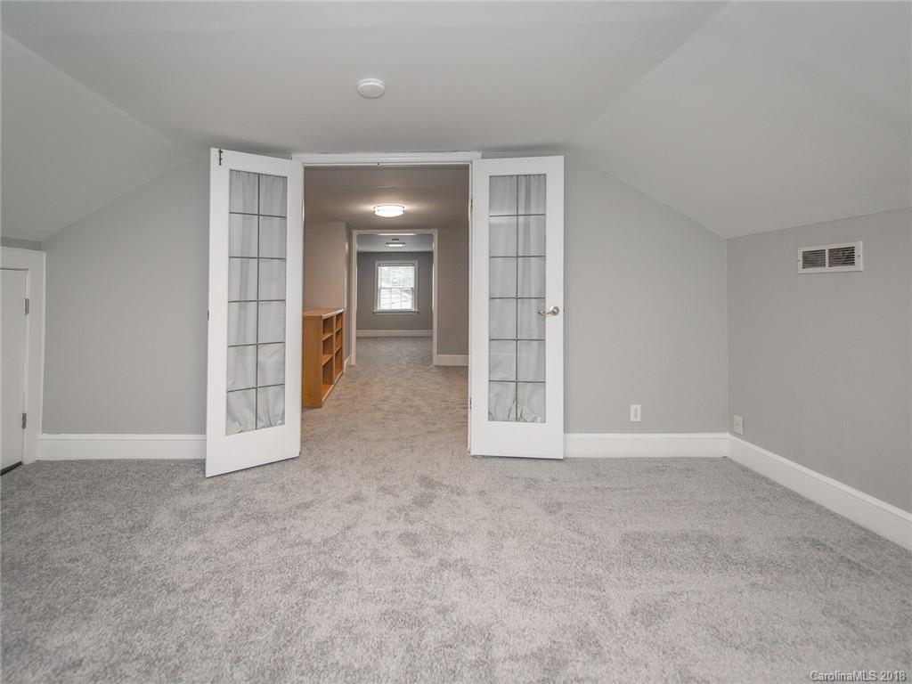 2711 Providence Road Charlotte, NC 28211 - Photo 26 of 35 an empty room with windows and pillars in it