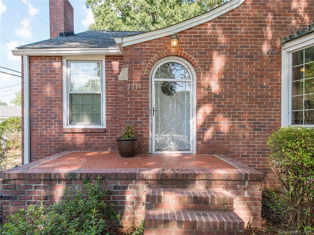 2711 Providence Road Charlotte, NC 28211 - Photo 4 of 35 a front view of a house with garden