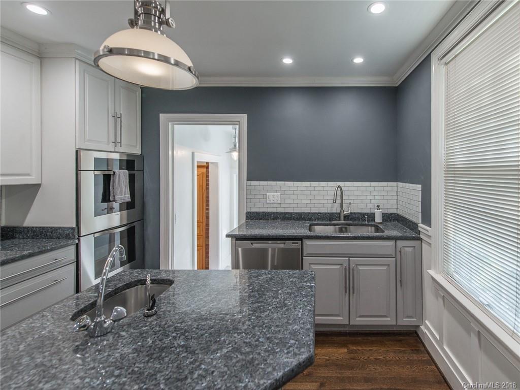 2711 Providence Road Charlotte, NC 28211 - Photo 10 of 35 a kitchen with a stove and a refrigerator