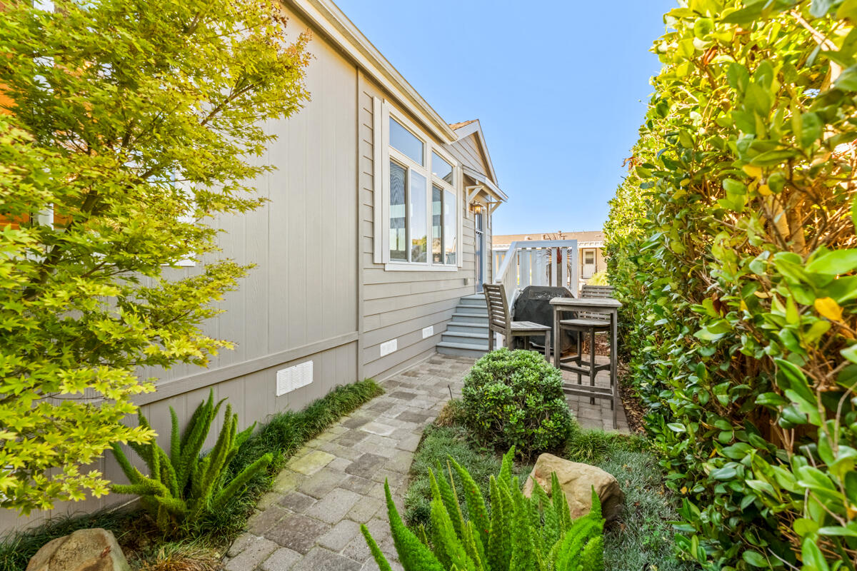 3950 Via Real, Unit 97 Carpinteria, CA 93013 - Photo 12 of 38 a backyard of a house with table and chairs