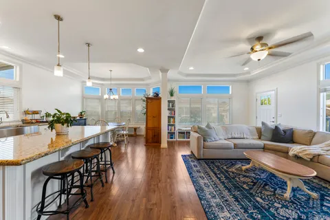 a dining room with stainless steel appliances furniture or kitchen view and a living room view