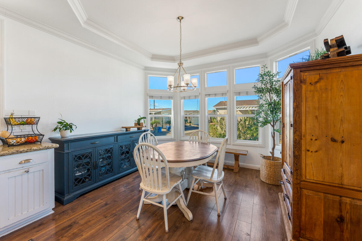 3950 Via Real, Unit 97 Carpinteria, CA 93013 - Photo 20 of 38 a dining room with furniture a chandelier and wooden floor