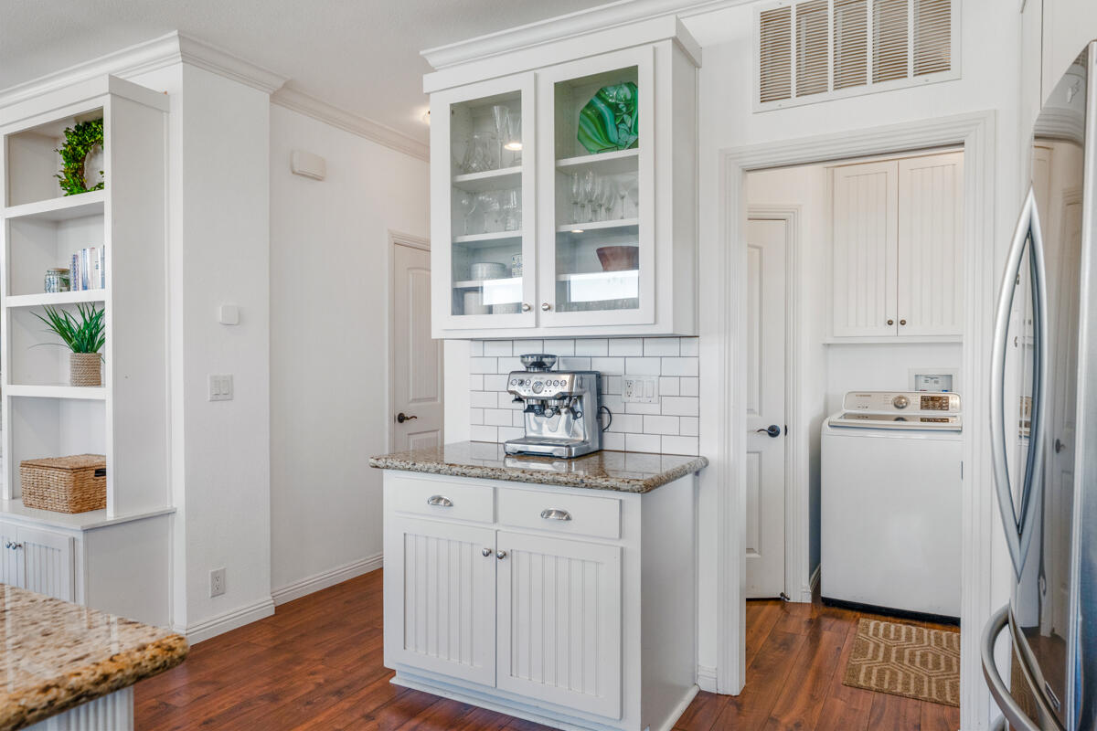 3950 Via Real, Unit 97 Carpinteria, CA 93013 - Photo 22 of 38 a hallway with cabinets and wooden floor
